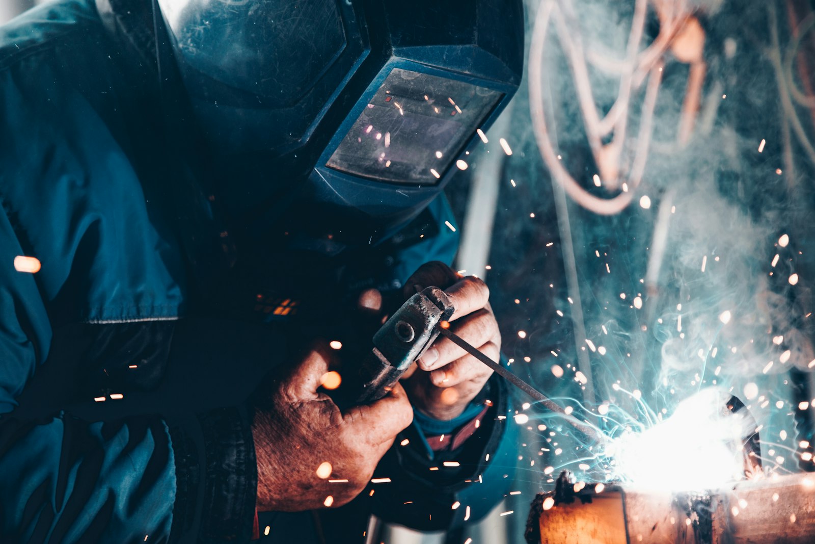 Technician welding pipe joints