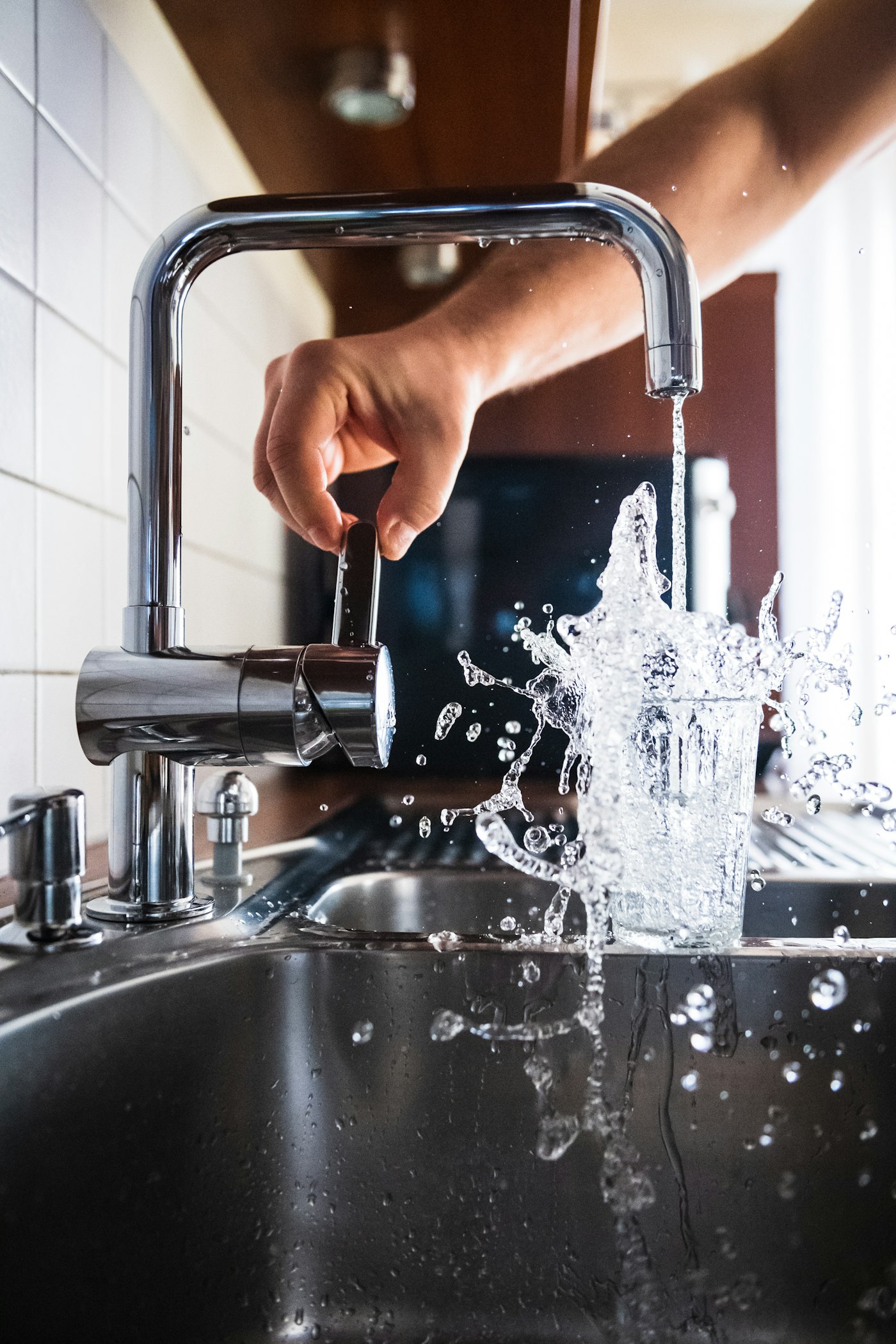 Calloway plumber testing a newly installed kitchen faucet